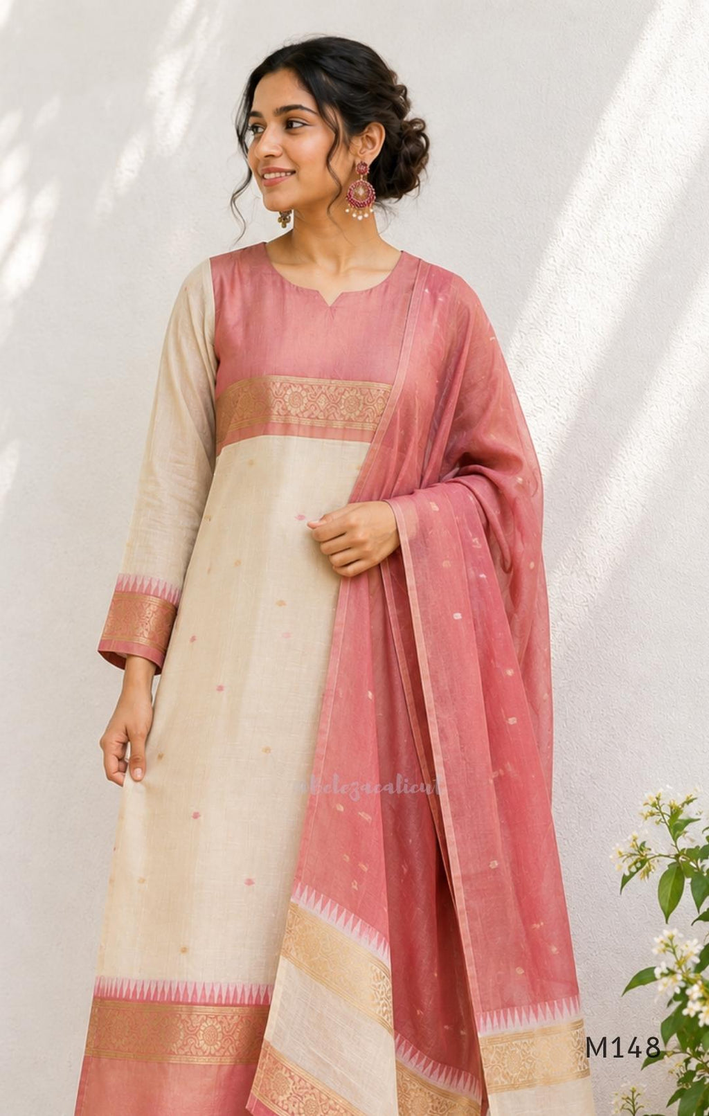 Rose pink and ivory tissue blend churidar set with woven gold borders, scattered motifs, straight bottom and matching dupatta.