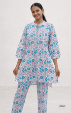 Woman wearing a floral kurta with pants on a white background