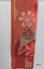 Red fabric with floral patterns and a central emblem on a white background