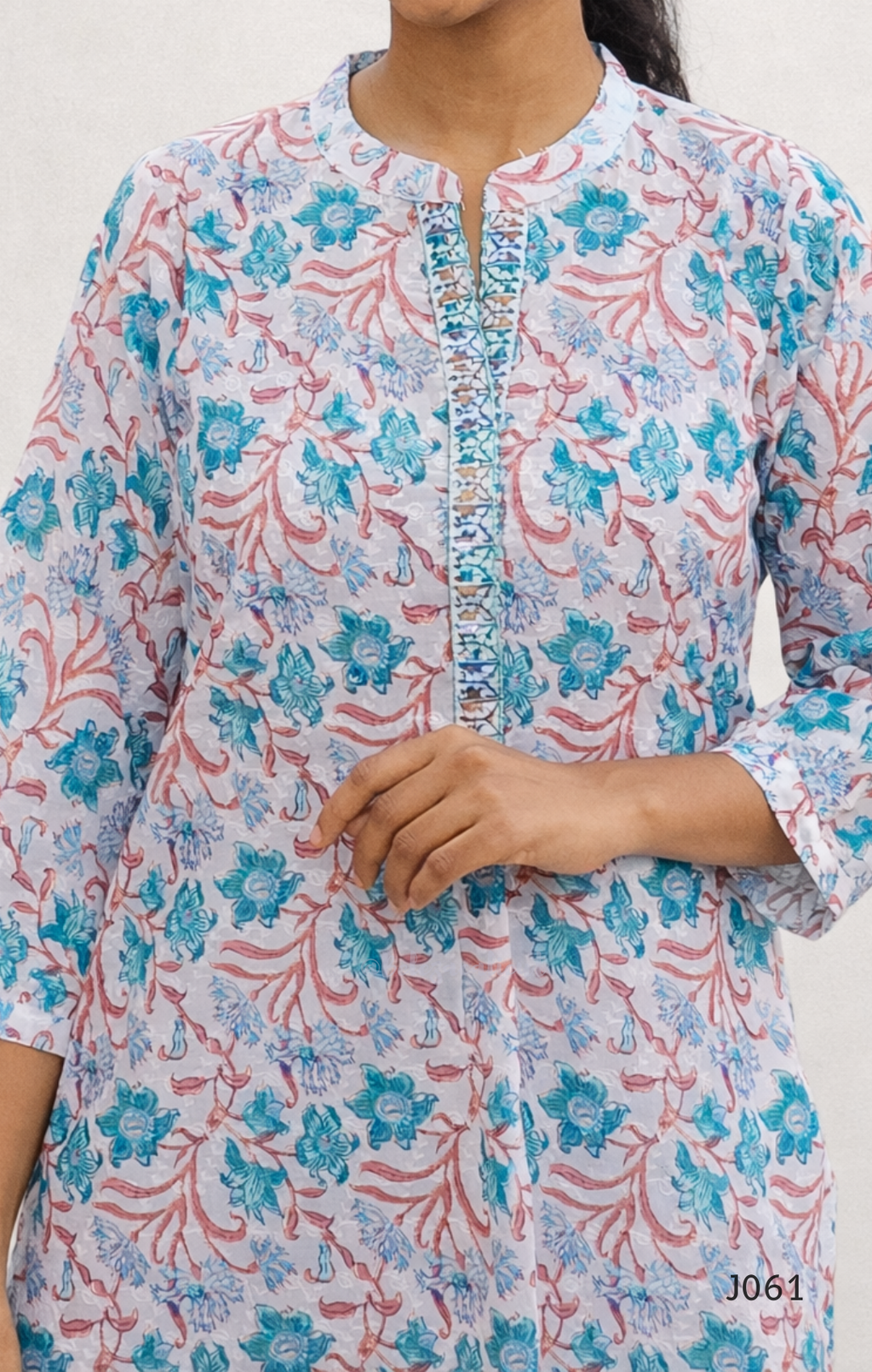 Floral patterned kurta worn by a person on a white background