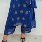 Blue embroidered outfit with a white background