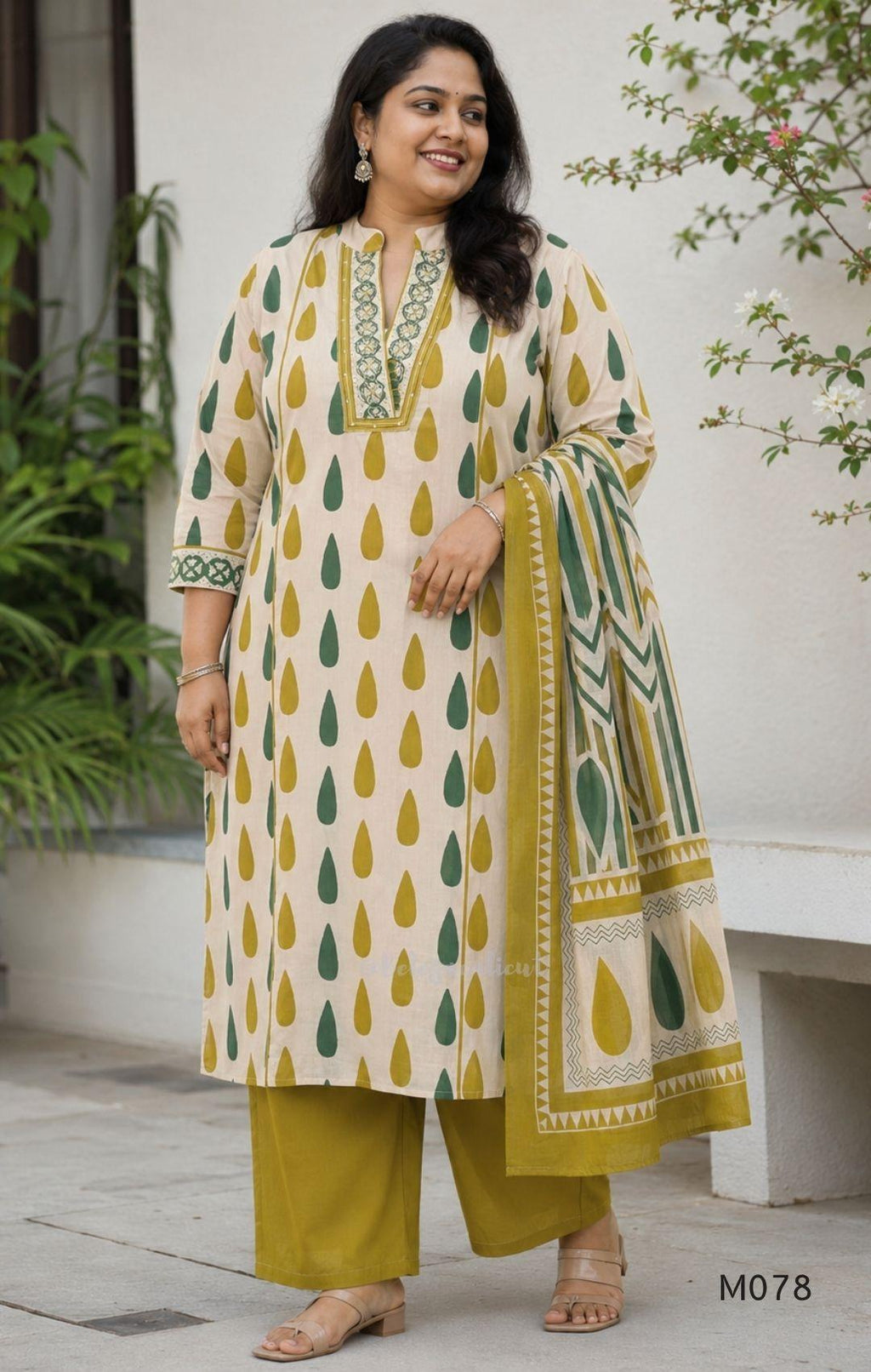 Beige cotton 3-piece churidar set with green and mustard drop motif, embroidered neckline, mustard bottom and printed dupatta.