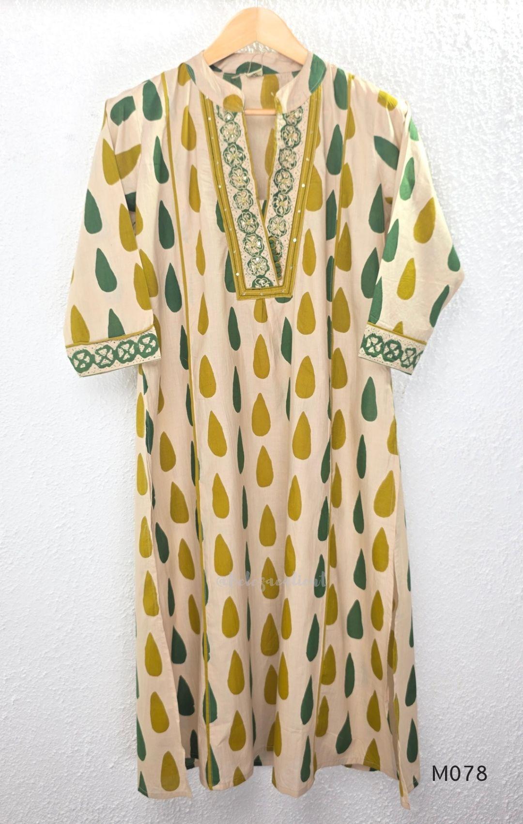 Beige cotton 3-piece churidar set with green and mustard drop motif, embroidered neckline, mustard bottom and printed dupatta.