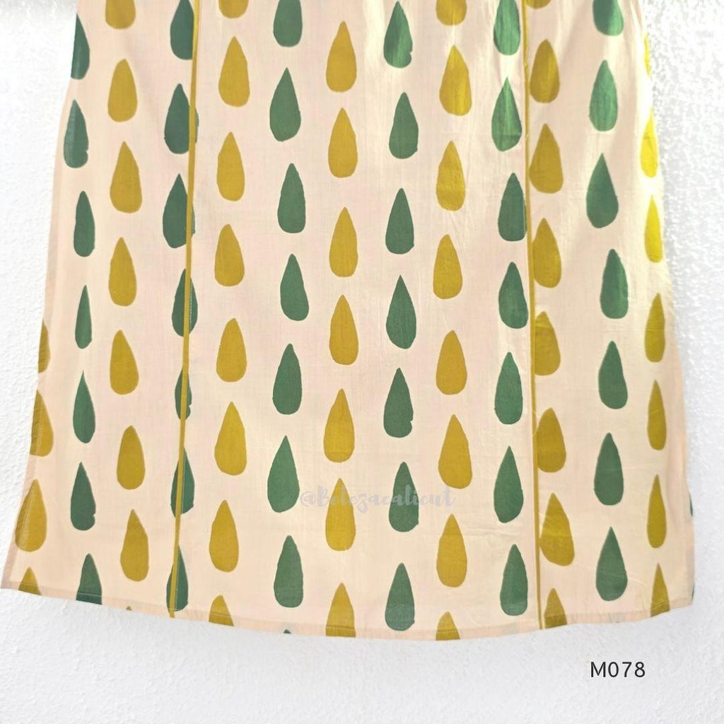 Beige cotton 3-piece churidar set with green and mustard drop motif, embroidered neckline, mustard bottom and printed dupatta.