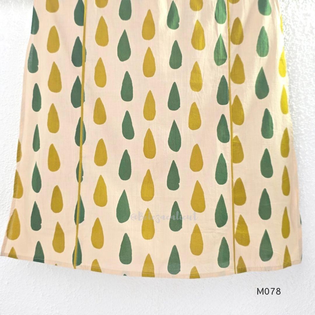 Beige cotton 3-piece churidar set with green and mustard drop motif, embroidered neckline, mustard bottom and printed dupatta.