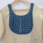 Beige cotton women’s ethnic top with teal embroidered yoke, short sleeves, and simple straight fit.