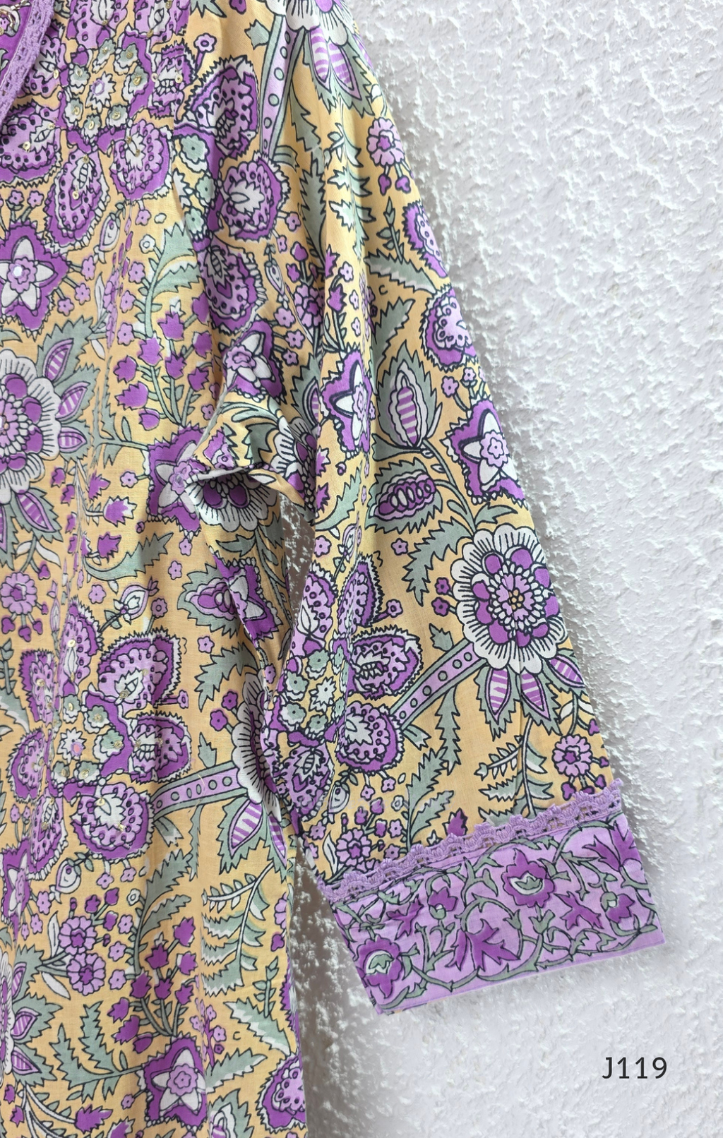 Beige mustard cotton 3-piece churidar set with lavender floral block print, gold V-neckline detail, ivory dupatta and matching printed bottom.
