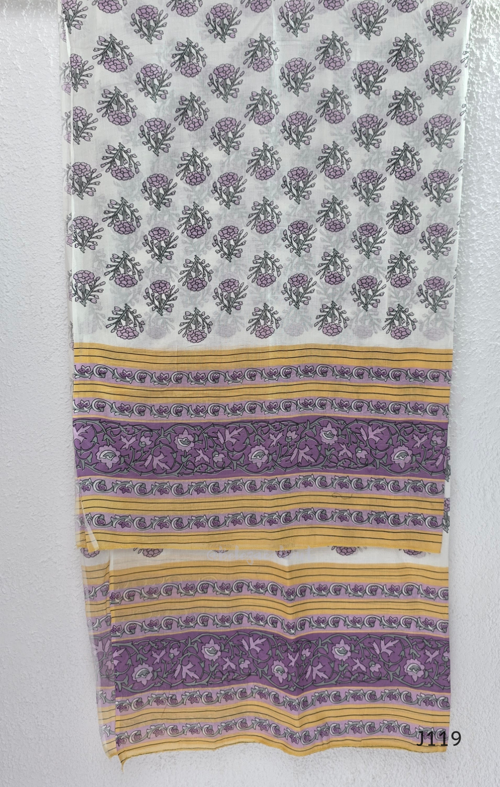 Beige mustard cotton 3-piece churidar set with lavender floral block print, gold V-neckline detail, ivory dupatta and matching printed bottom.