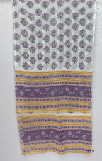 Beige mustard cotton 3-piece churidar set with lavender floral block print, gold V-neckline detail, ivory dupatta and matching printed bottom.