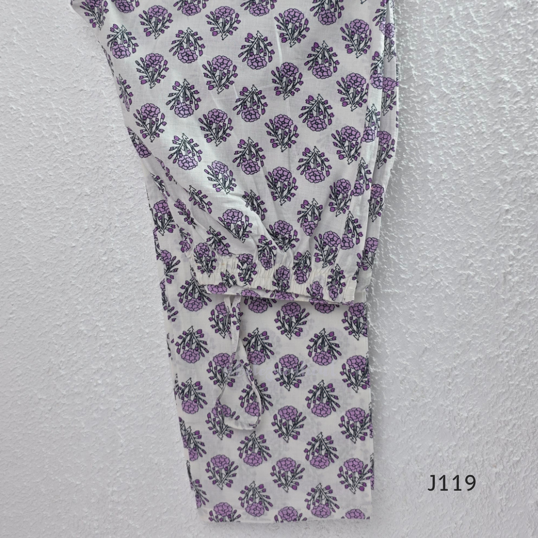 Beige mustard cotton 3-piece churidar set with lavender floral block print, gold V-neckline detail, ivory dupatta and matching printed bottom.