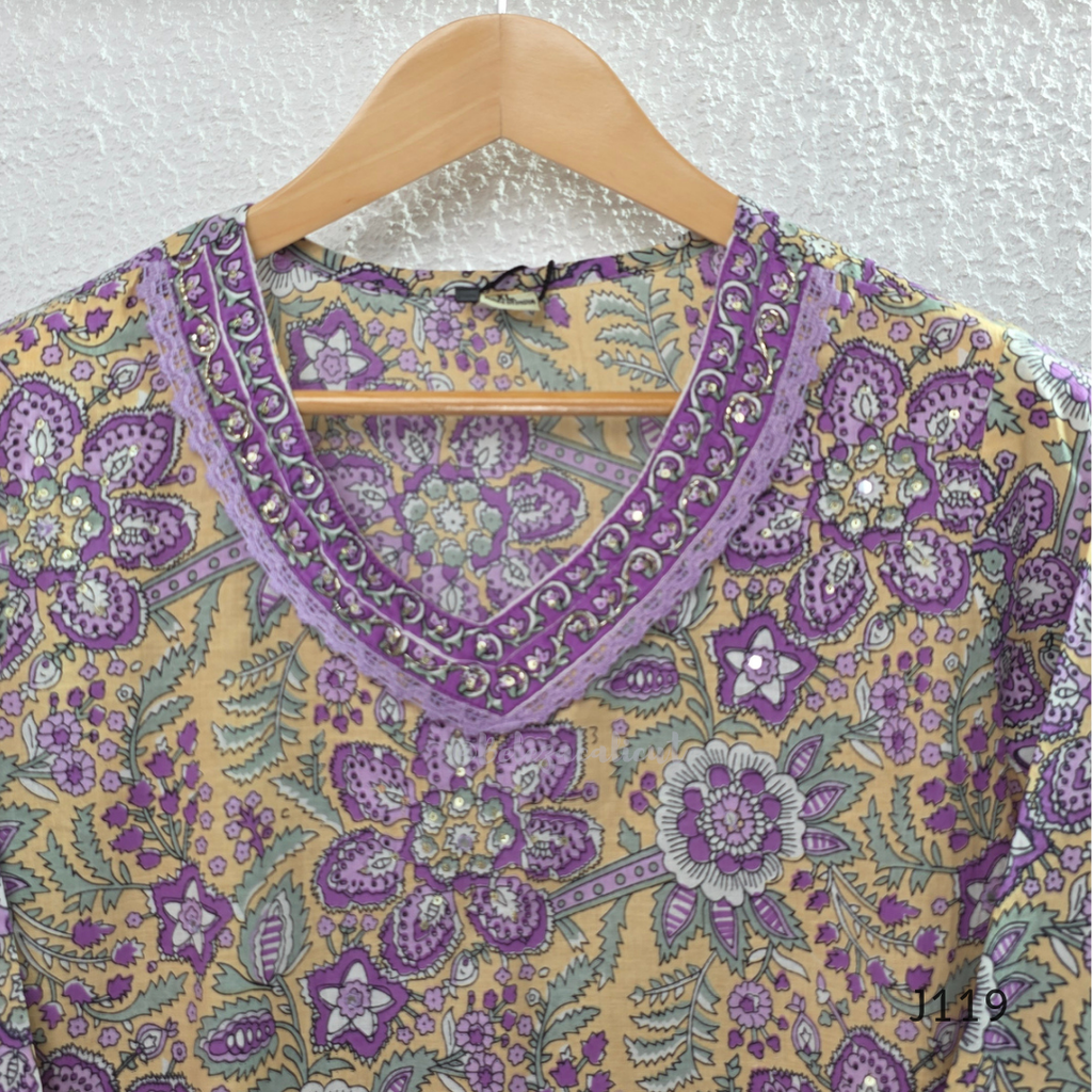 Beige mustard cotton 3-piece churidar set with lavender floral block print, gold V-neckline detail, ivory dupatta and matching printed bottom.