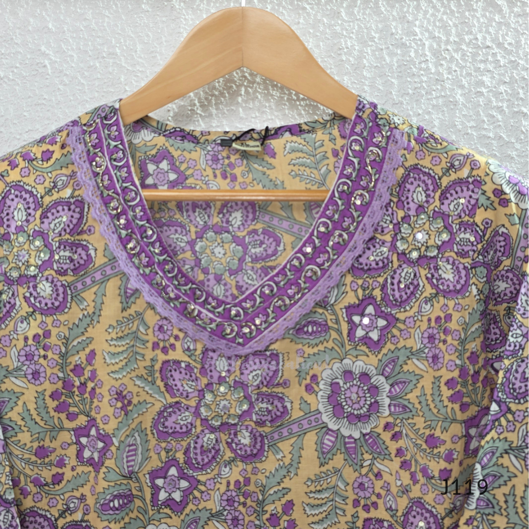 Beige mustard cotton 3-piece churidar set with lavender floral block print, gold V-neckline detail, ivory dupatta and matching printed bottom.