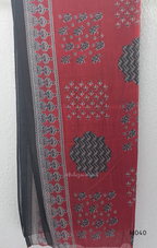 Black cotton 3-piece churidar set with red Ajrakh-style printed yoke, matching printed dupatta, and plain black pant.