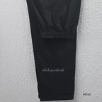 Black cotton 3-piece churidar set with red Ajrakh-style printed yoke, matching printed dupatta, and plain black pant.