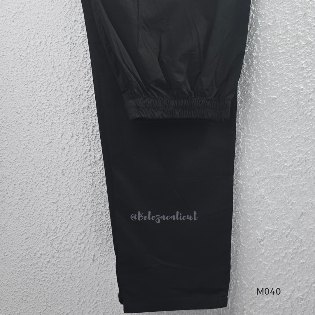 Black cotton 3-piece churidar set with red Ajrakh-style printed yoke, matching printed dupatta, and plain black pant.