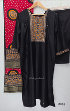 Black Gajji silk plus size churidar set with embroidered yoke, sleeve border, matching black bottom and contrast red printed dupatta.