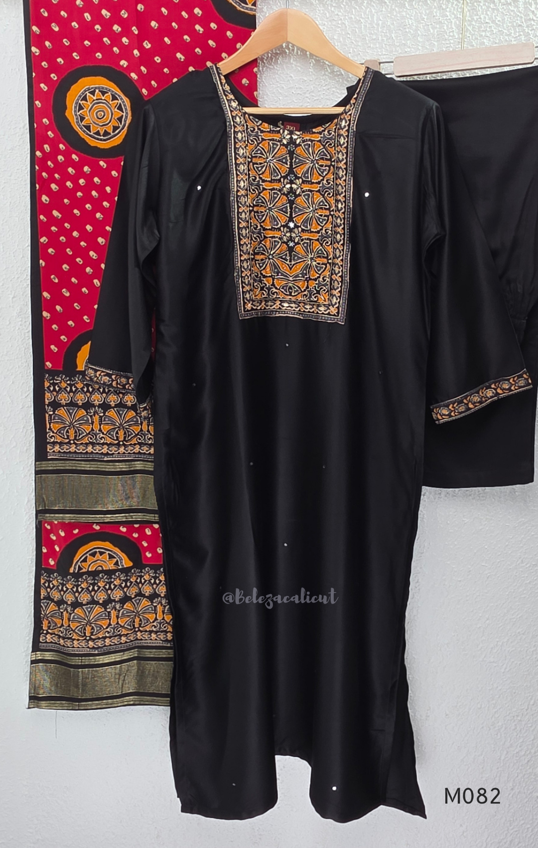 Black Gajji silk plus size churidar set with embroidered yoke, sleeve border, matching black bottom and contrast red printed dupatta.