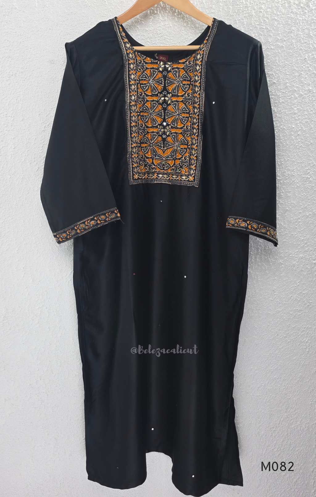 Black Gajji silk plus size churidar set with embroidered yoke, sleeve border, matching black bottom and contrast red printed dupatta.