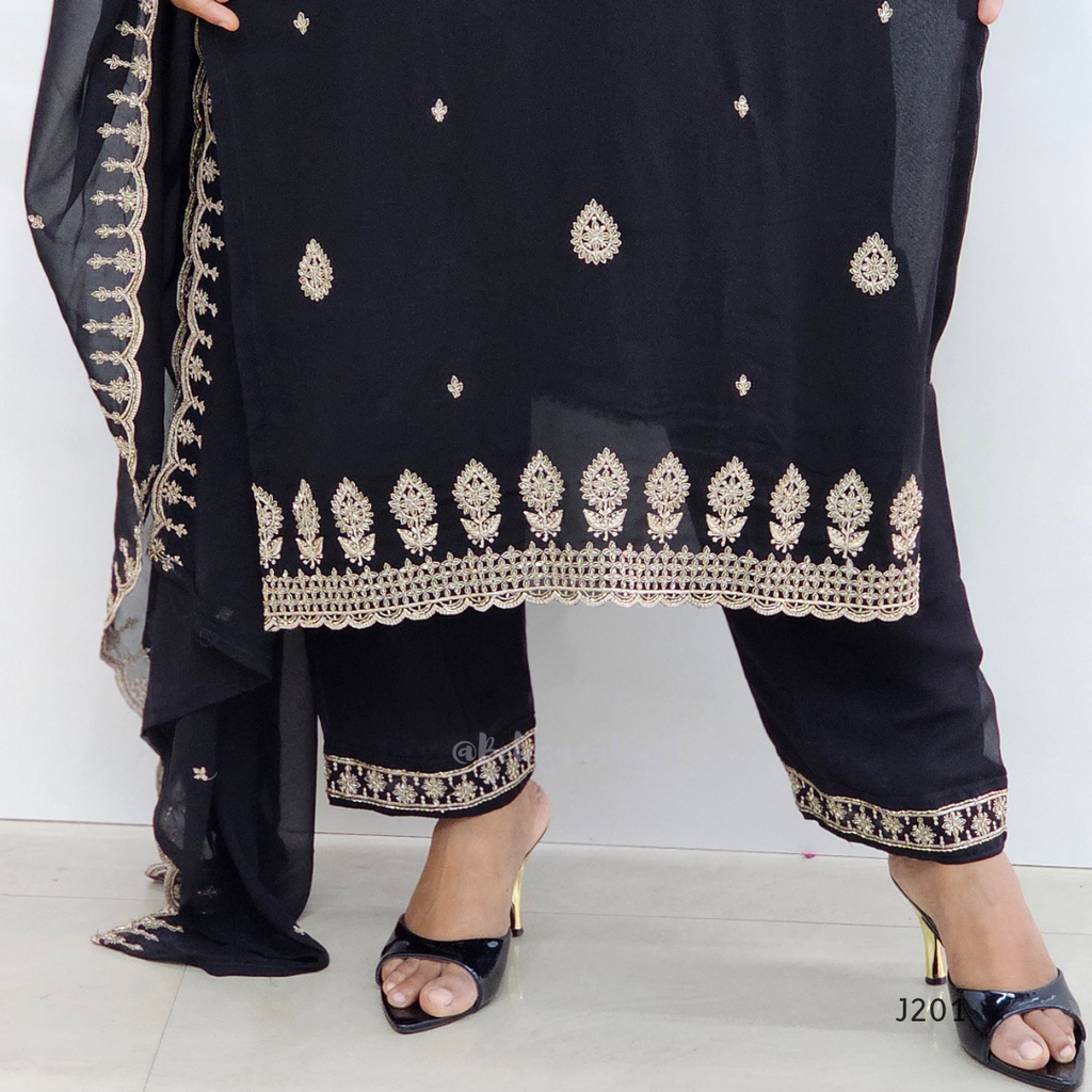 Black traditional outfit with gold embroidery on a white background