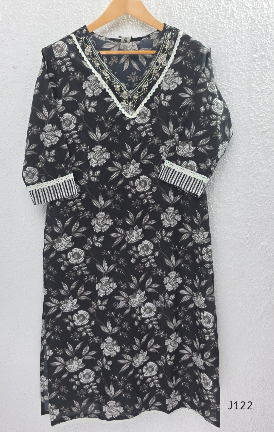 Black Jaipur cotton 3-piece churidar set with grey-white floral print, V-neck detail, printed dupatta and striped matching bottom.