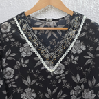 Black Jaipur cotton 3-piece churidar set with grey-white floral print, V-neck detail, printed dupatta and striped matching bottom.