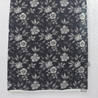 Black Jaipur cotton 3-piece churidar set with grey-white floral print, V-neck detail, printed dupatta and striped matching bottom.