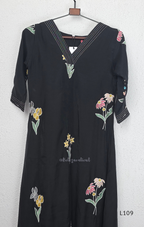 Black mul chanderi A-line kurti with colourful floral embroidery, V-neck stitch detail and 3/4 sleeves