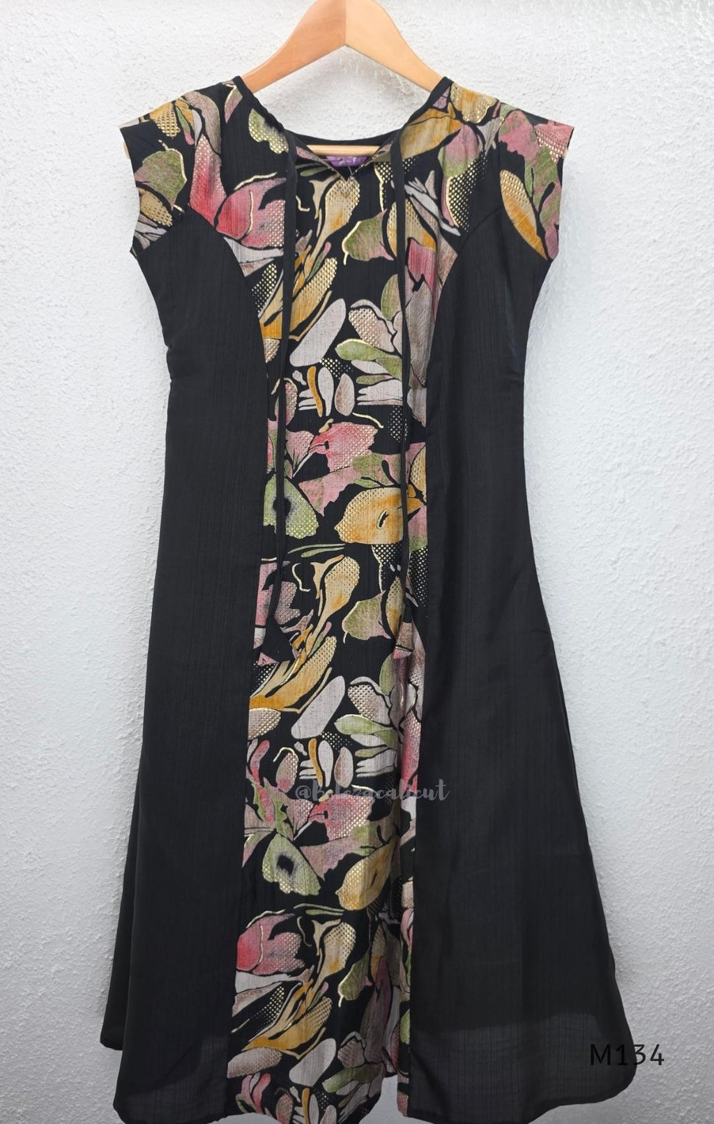 Black silk blend A-line long kurta with muted multicolour abstract floral centre panel and plain black side panels.