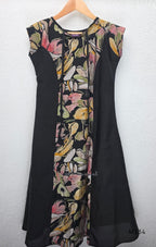 Black silk blend A-line long kurta with muted multicolour abstract floral centre panel and plain black side panels.