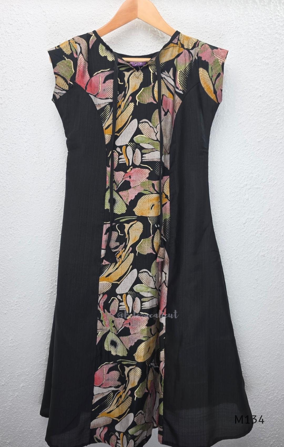 Black silk blend A-line long kurta with muted multicolour abstract floral centre panel and plain black side panels.
