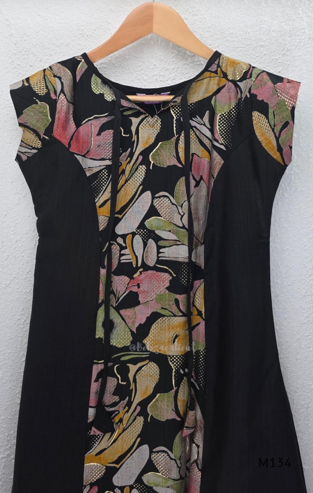 Black silk blend A-line long kurta with muted multicolour abstract floral centre panel and plain black side panels.
