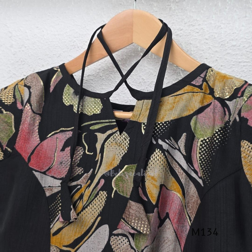 Black silk blend A-line long kurta with muted multicolour abstract floral centre panel and plain black side panels.