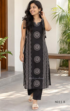 Black Vertigan silk printed co-ord set with straight mid-calf top and matching straight pants.