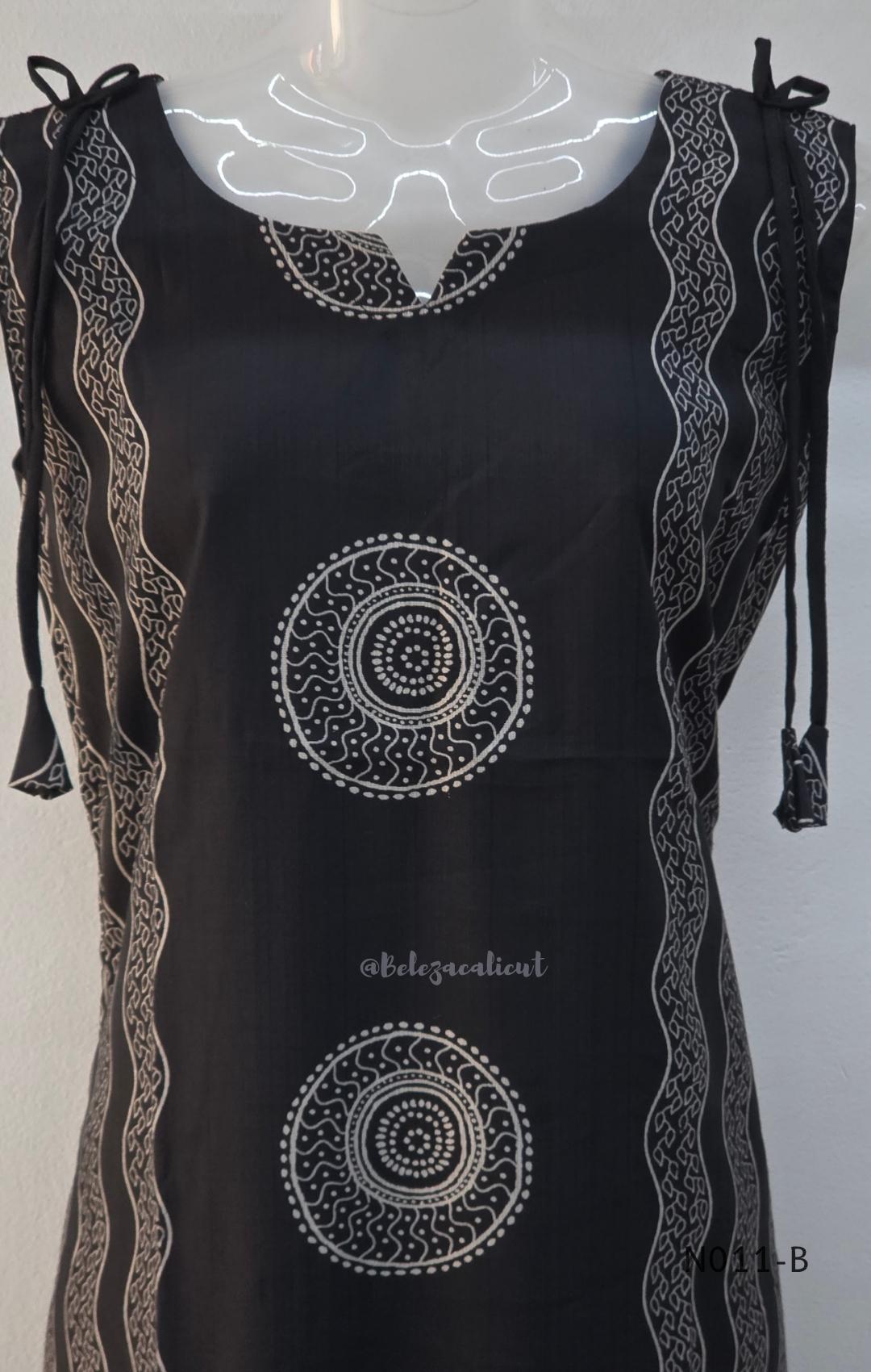 Black Vertigan silk printed co-ord set with straight mid-calf top and matching straight pants.
