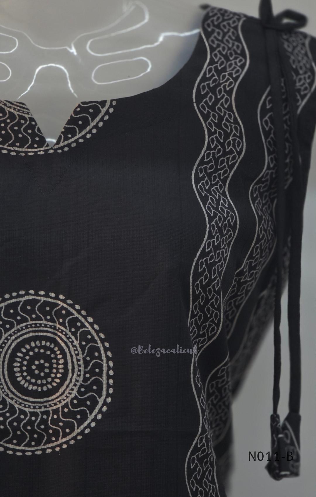 Black Vertigan silk printed co-ord set with straight mid-calf top and matching straight pants.
