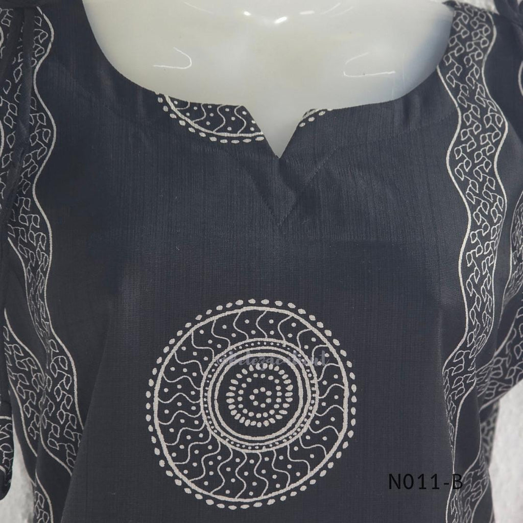 Black Vertigan silk printed co-ord set with straight mid-calf top and matching straight pants.