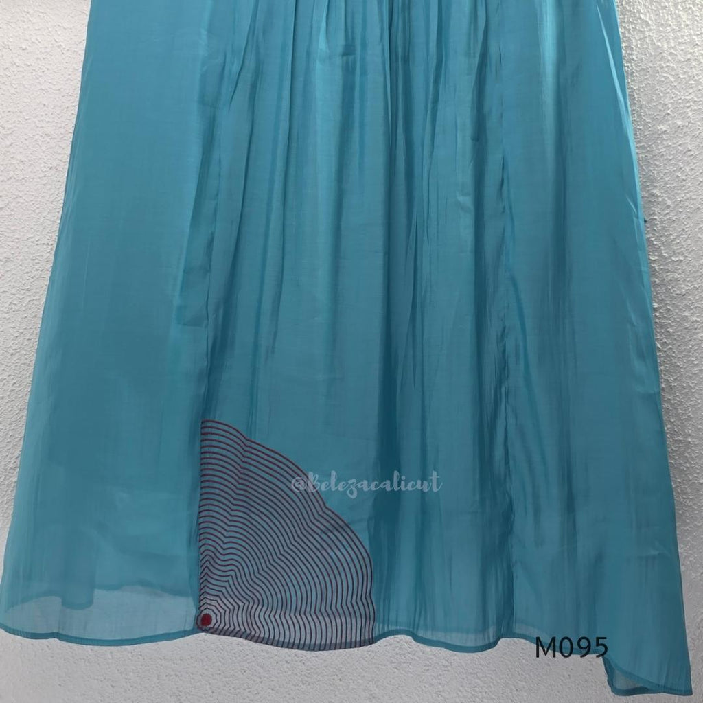 Black and teal blue Mul Chanderi 3-piece churidar sets with red circular embroidery and coordinated dupattas.