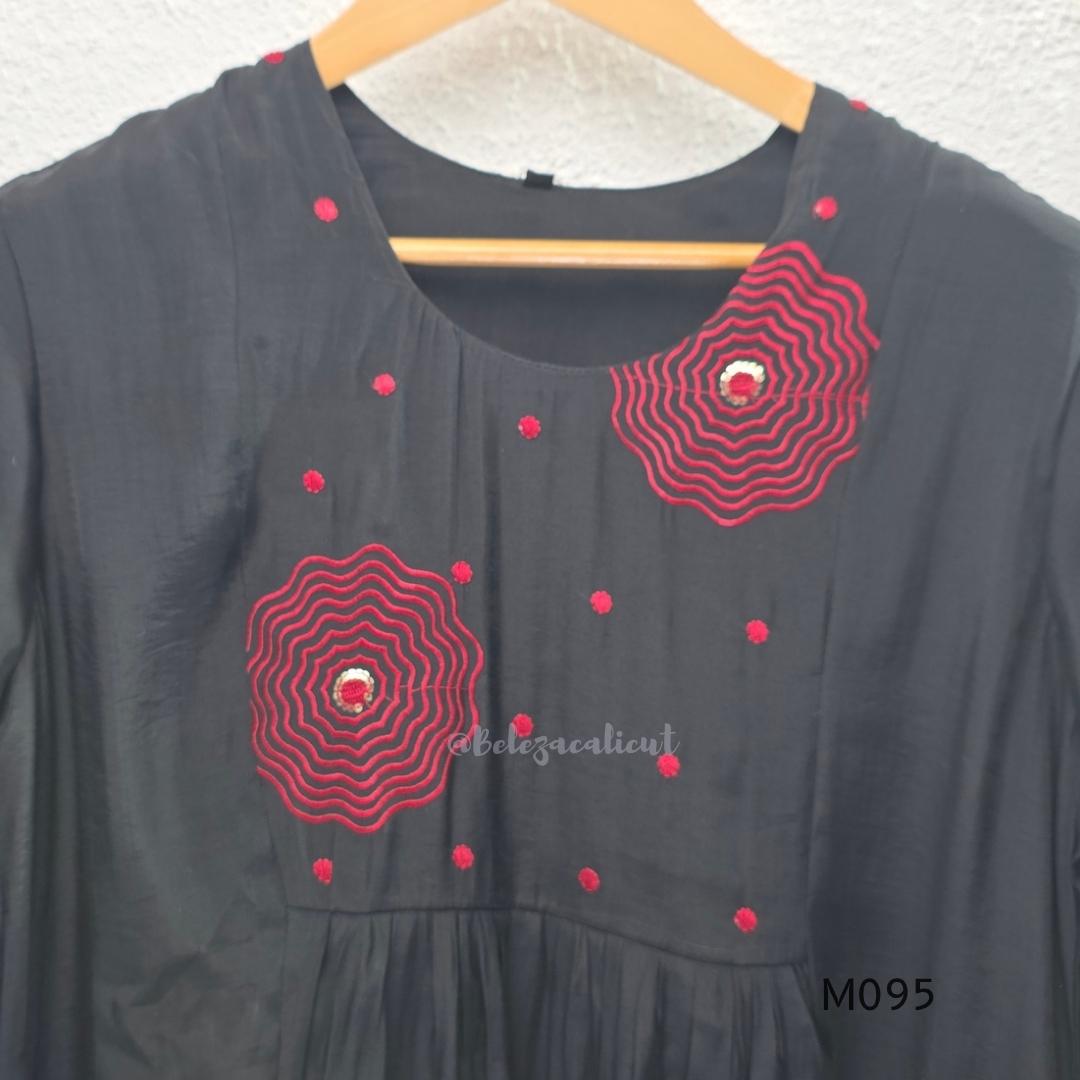 Black and teal blue Mul Chanderi 3-piece churidar sets with red circular embroidery and coordinated dupattas.