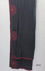 Black and teal blue Mul Chanderi 3-piece churidar sets with red circular embroidery and coordinated dupattas.