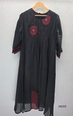 Black and teal blue Mul Chanderi 3-piece churidar sets with red circular embroidery and coordinated dupattas.