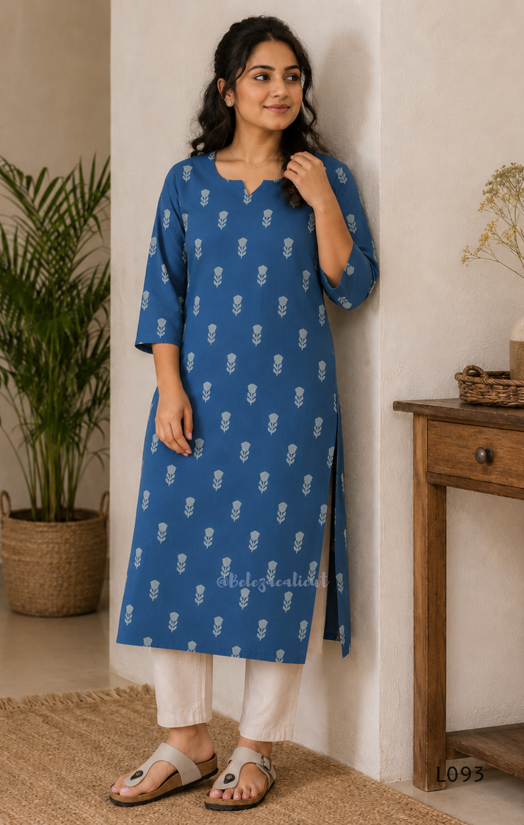 Blue cotton women’s top with light leaf print, notch neckline, elbow-length sleeves, and straight everyday fit.