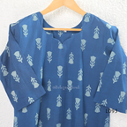 Blue cotton women’s top with light leaf print, notch neckline, elbow-length sleeves, and straight everyday fit.