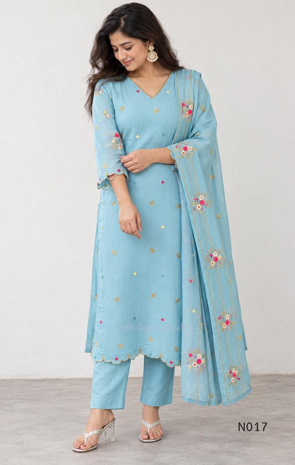 Aqua blue  Mul Chanderi three-piece churidar sets with floral embroidery, scalloped kurta hems and cuffs, plain pants and matching dupattas.
