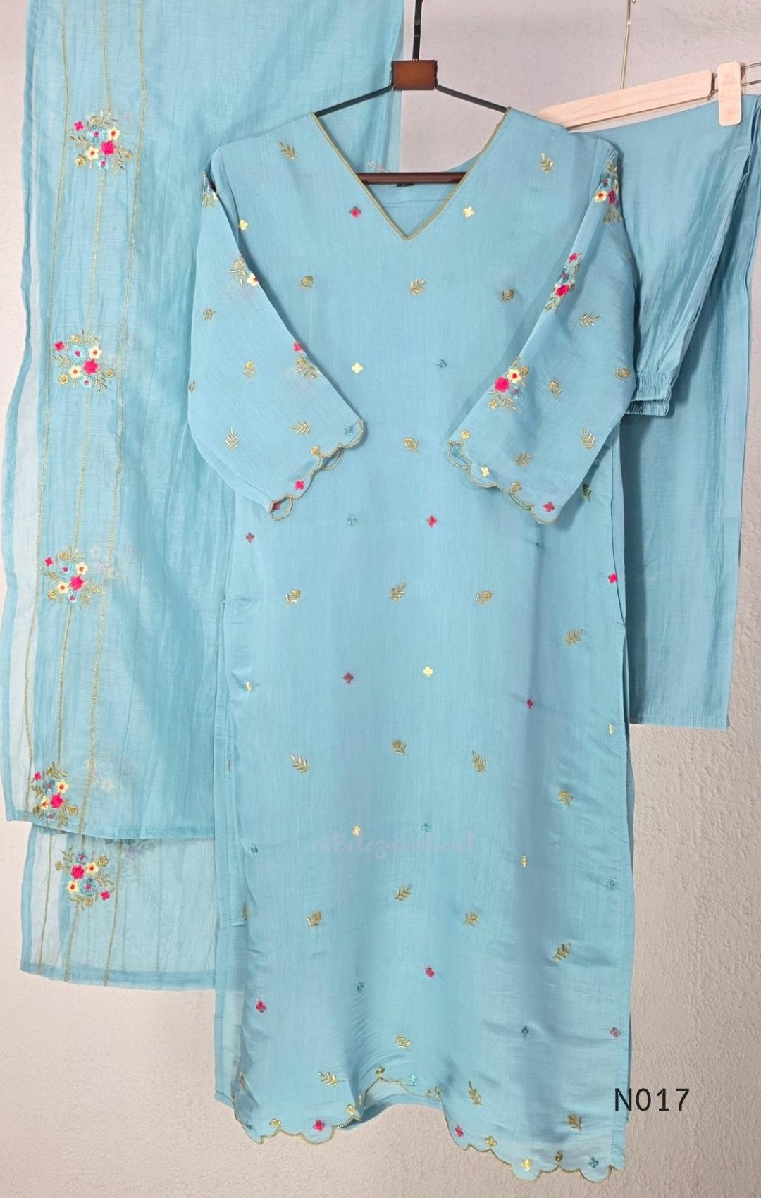 Aqua blue  Mul Chanderi three-piece churidar sets with floral embroidery, scalloped kurta hems and cuffs, plain pants and matching dupattas.