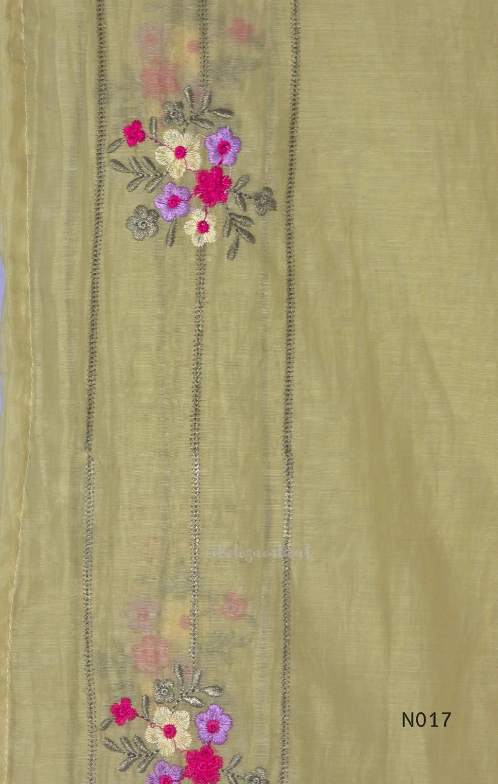 yellow Mul Chanderi three-piece churidar sets with floral embroidery, scalloped kurta hems and cuffs, plain pants and matching dupattas.