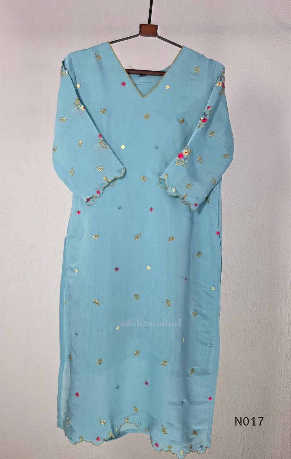 Aqua blue  Mul Chanderi three-piece churidar sets with floral embroidery, scalloped kurta hems and cuffs, plain pants and matching dupattas.