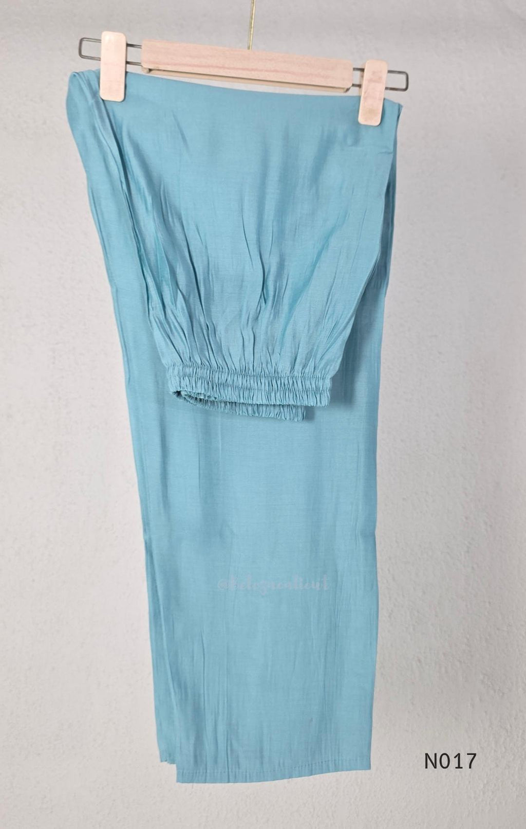 Aqua blue  Mul Chanderi three-piece churidar sets with floral embroidery, scalloped kurta hems and cuffs, plain pants and matching dupattas.