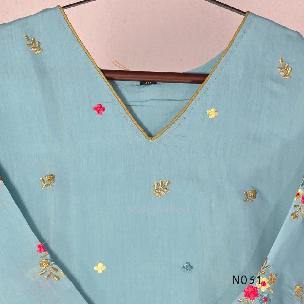 Aqua blue  Mul Chanderi three-piece churidar sets with floral embroidery, scalloped kurta hems and cuffs, plain pants and matching dupattas.