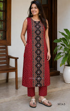 Brick red cotton top-and-bottom coord set with dotted print and black mirror-detail front panel.