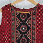 Brick red cotton top-and-bottom coord set with dotted print and black mirror-detail front panel.
